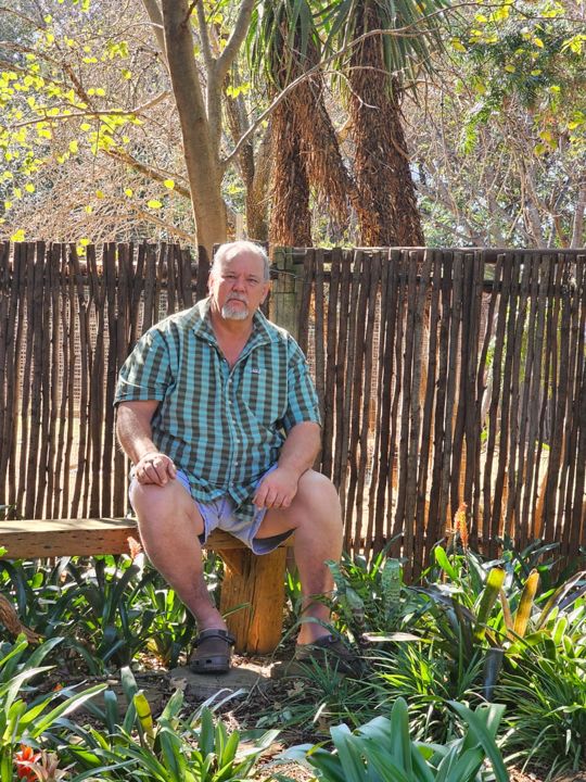 Craffie Crafford, Retha's husband, taking a break in the garden among the bromeliads at Craffenheim Rottweilers