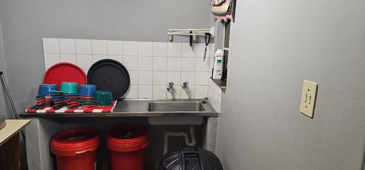Clean bowls stacked by the sink, ready for the next meal at Craffenheim Rottweilers