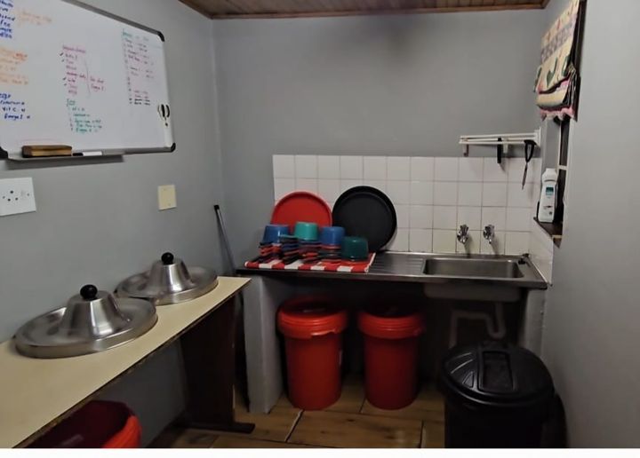 The Rottweilers' kitchen, with the feeding chart on the whiteboard and bowls ready on their stands at Craffenheim Rottweilers
