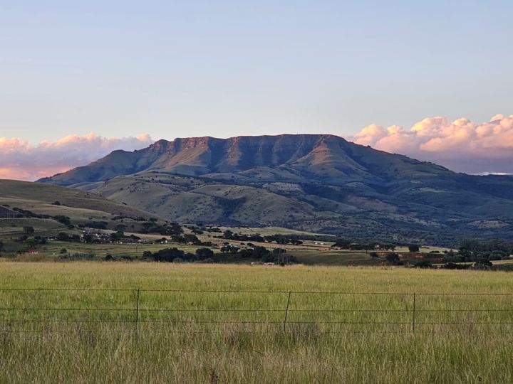 The mountain glowing at sunset over the open veld